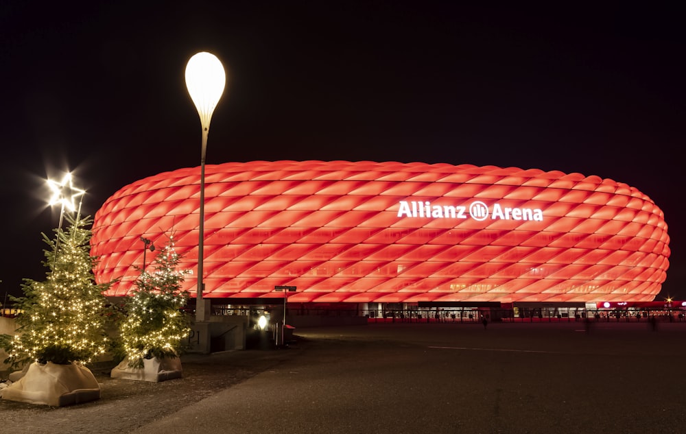 the allianz arena is lit up at night