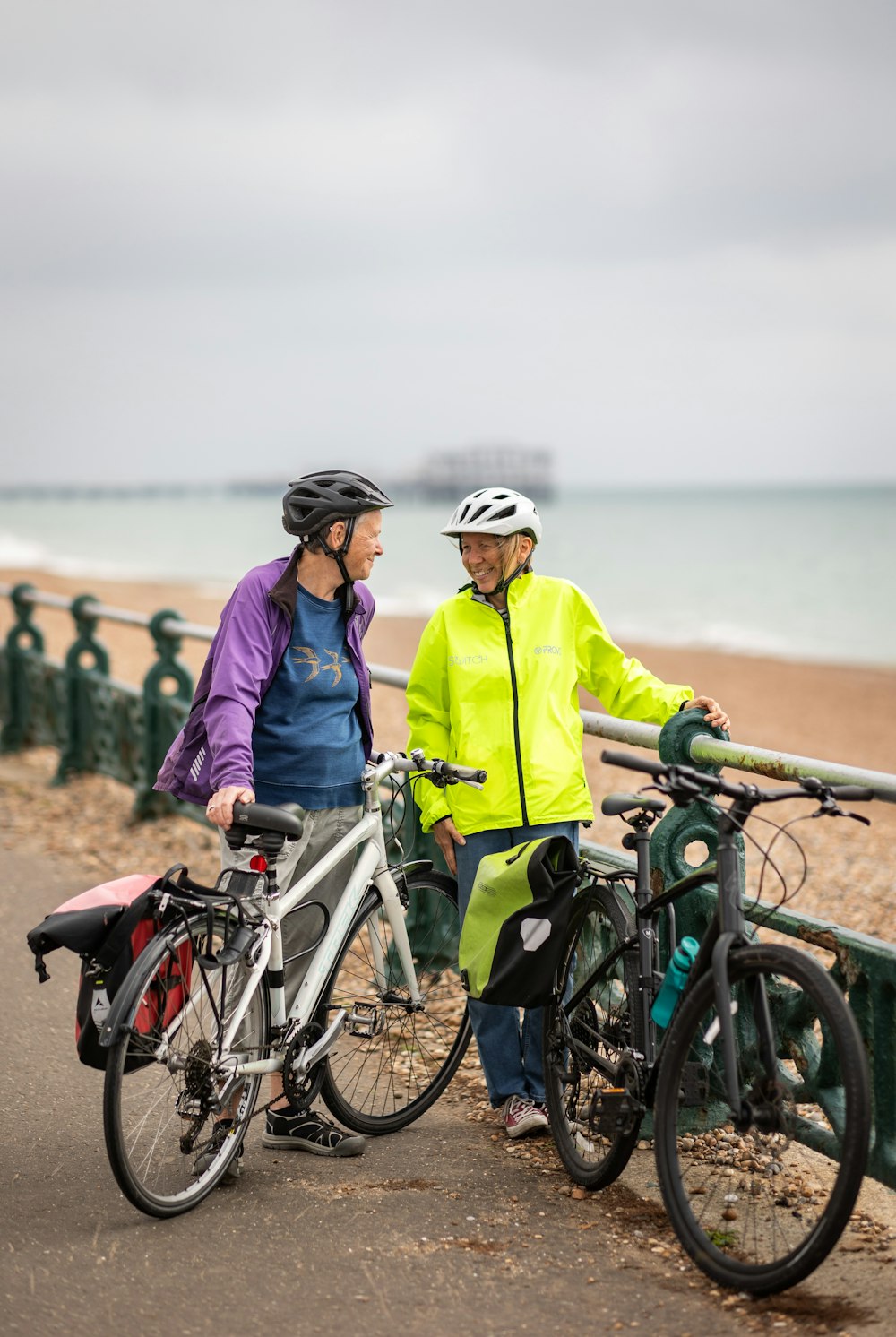 a man and a woman standing next to their bikes