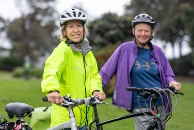 Senior women with bicycles enjoying gentle outdoor exercise