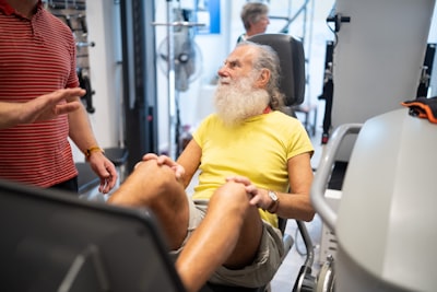 Senior doing seated leg exercises