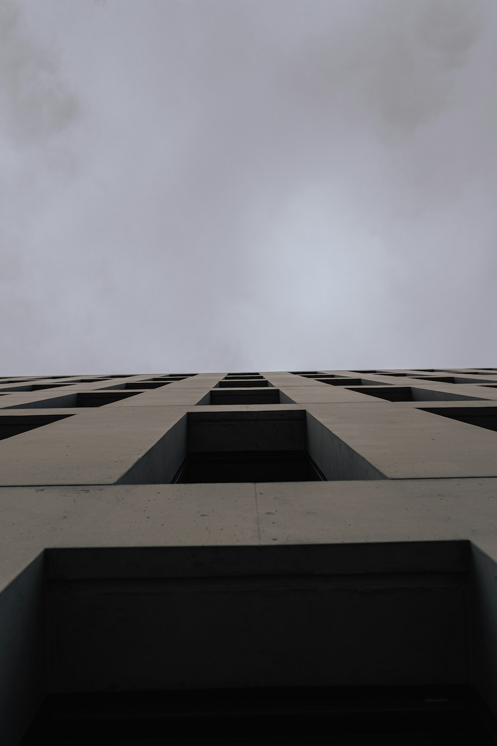 a tall building with a sky in the background