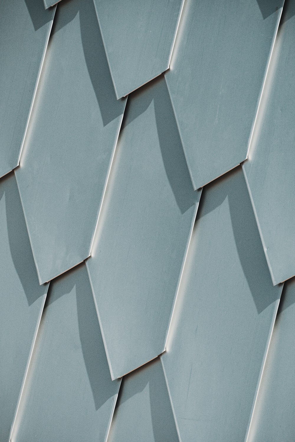 a close up of a building with hexagonal tiles
