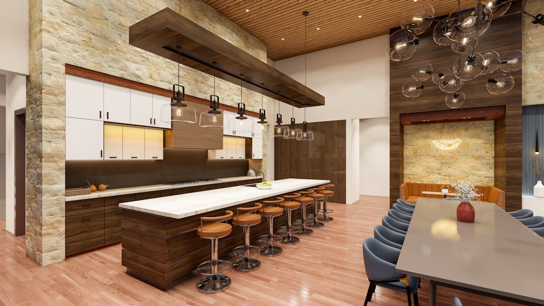 a large kitchen with a long counter and bar stools, Briand Neilson Residence C o n t e m p o r a r y H o u s e d e s i g n | A r c h i t e c t u r e Covered area: 5000 sft Style: Modern Contemporary Designed by: Salman Saqib Architects Visualized by: SD Studio