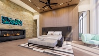 a living room with a large bed and a fireplace