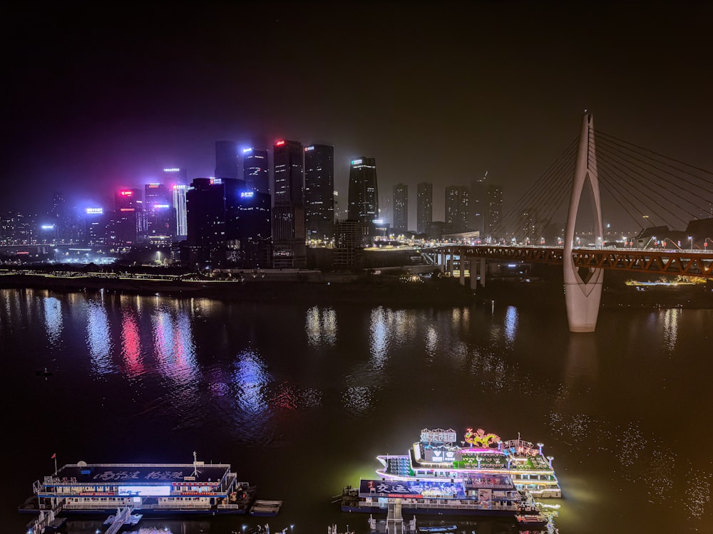 a large body of water with a bridge in the background