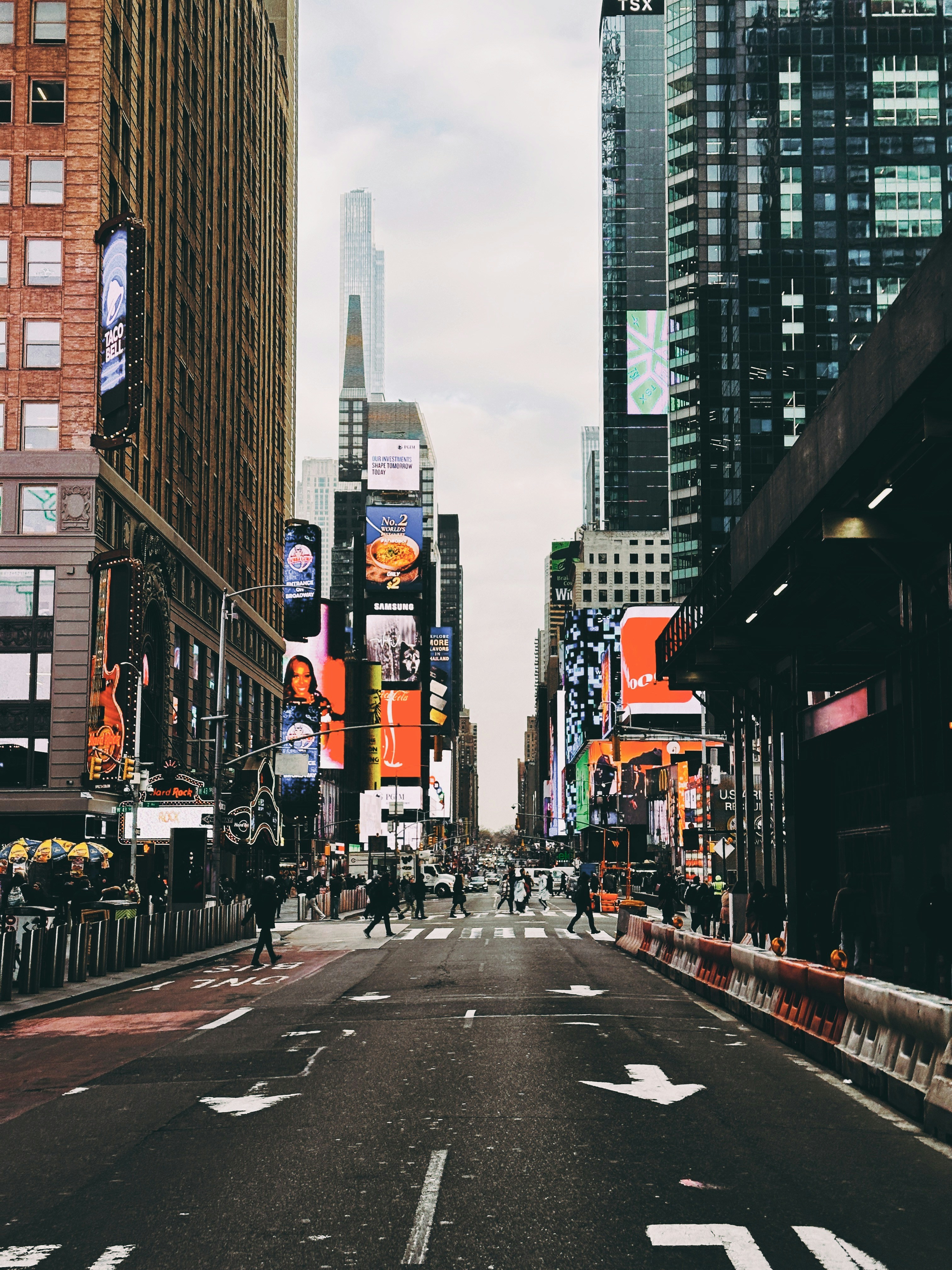 a city street filled with lots of tall buildings
