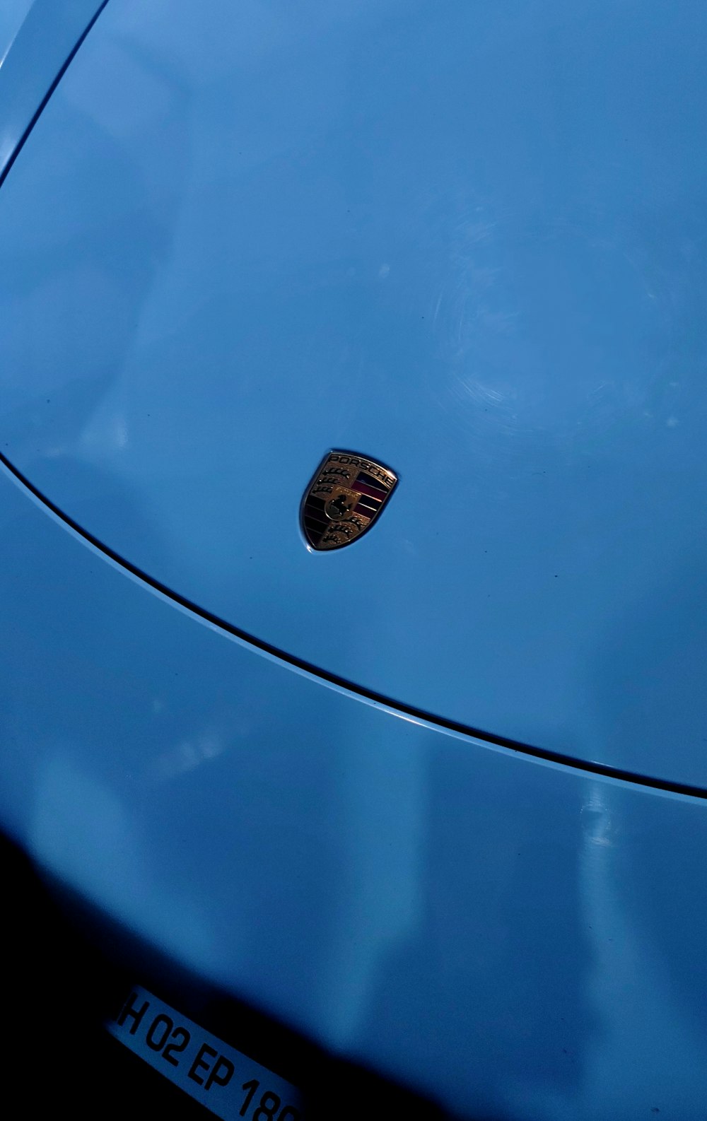 a close up of a blue sports car