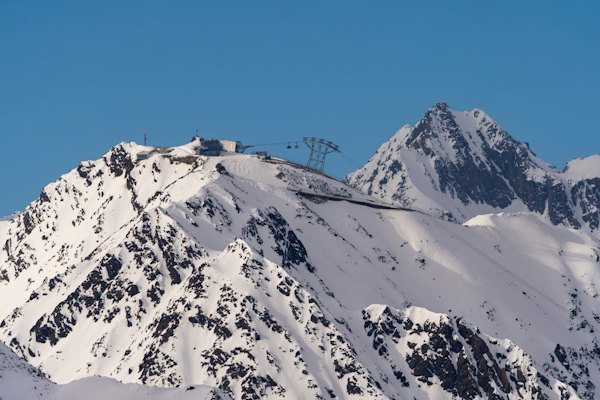 A mountain covered in snow with a ski lift on top of it — Sölden, Austria