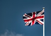 the UK flag - a flag flying in the wind on a clear day
