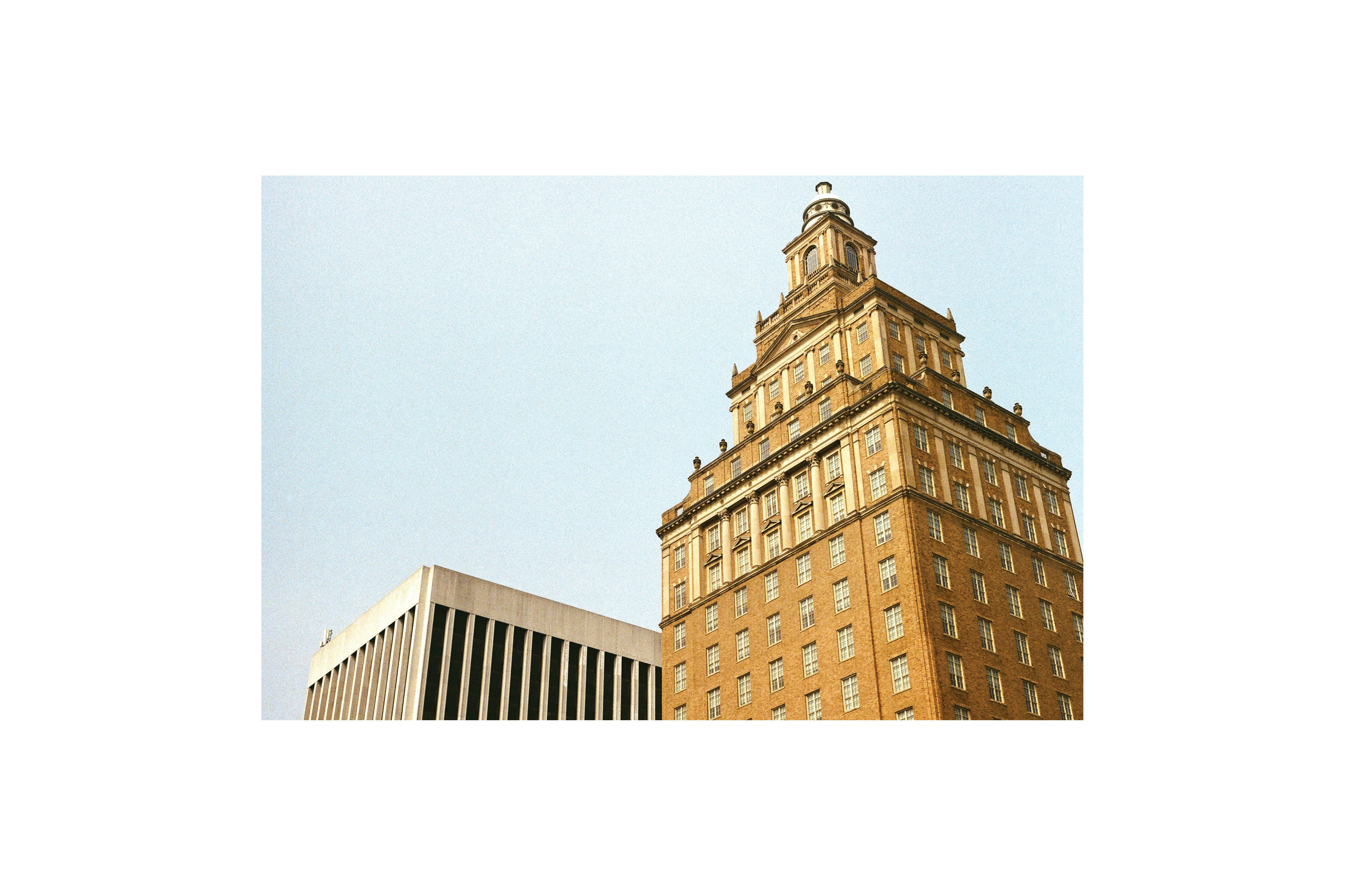 a tall building with a clock on the top of it