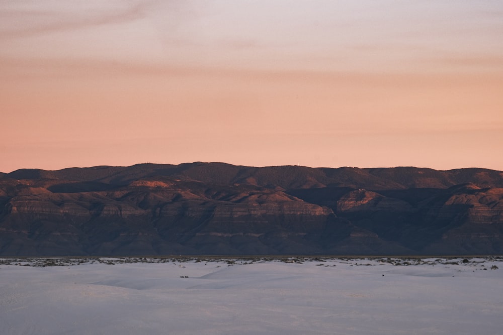 a view of a mountain range at sunset