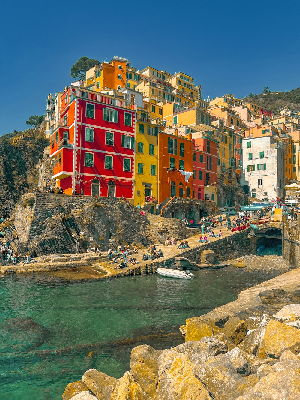 a group of buildings that are next to a body of water