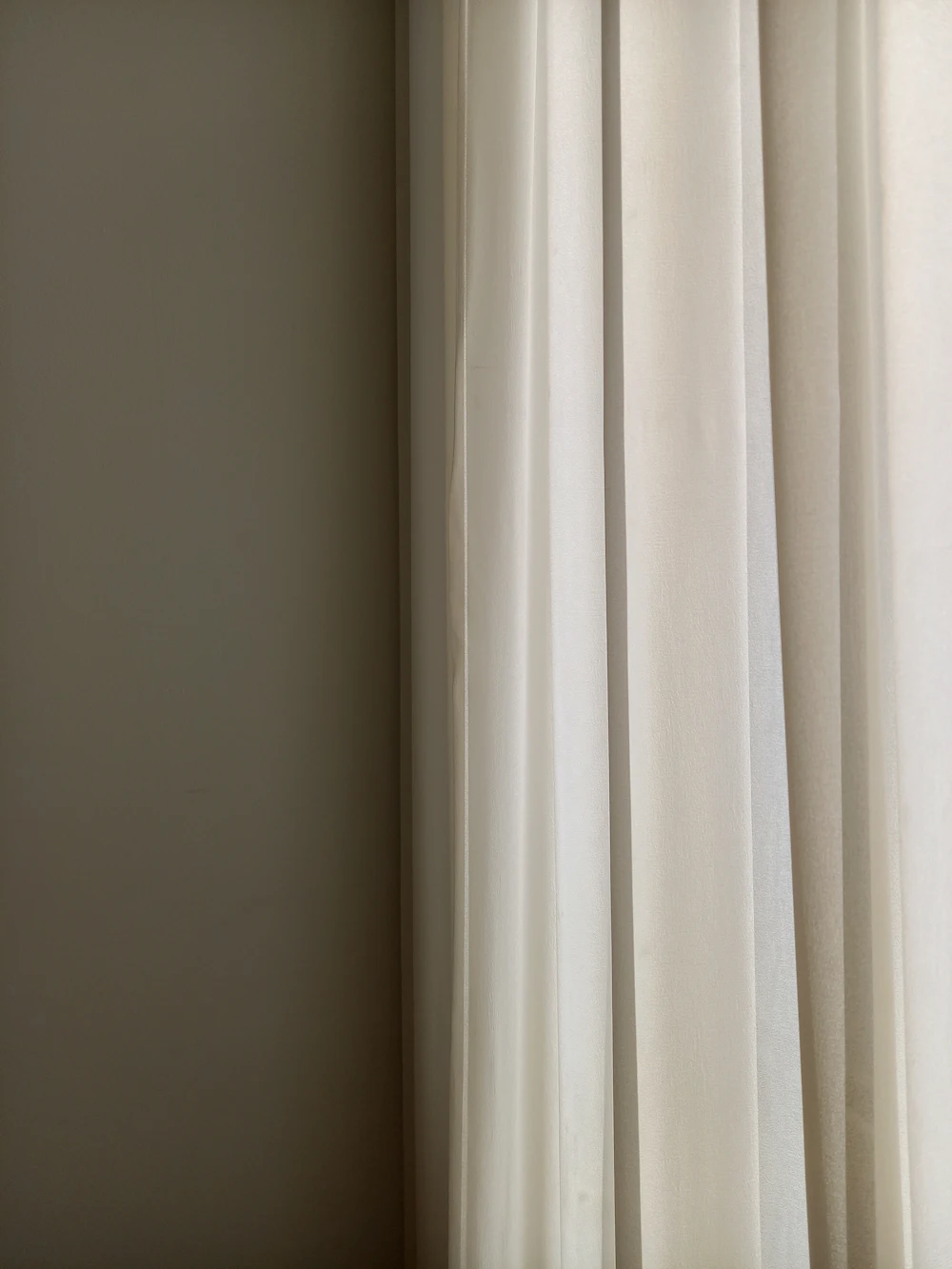 A repainted window wall with a clean white finish