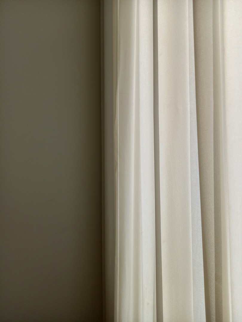 Soft natural light through sheer curtains