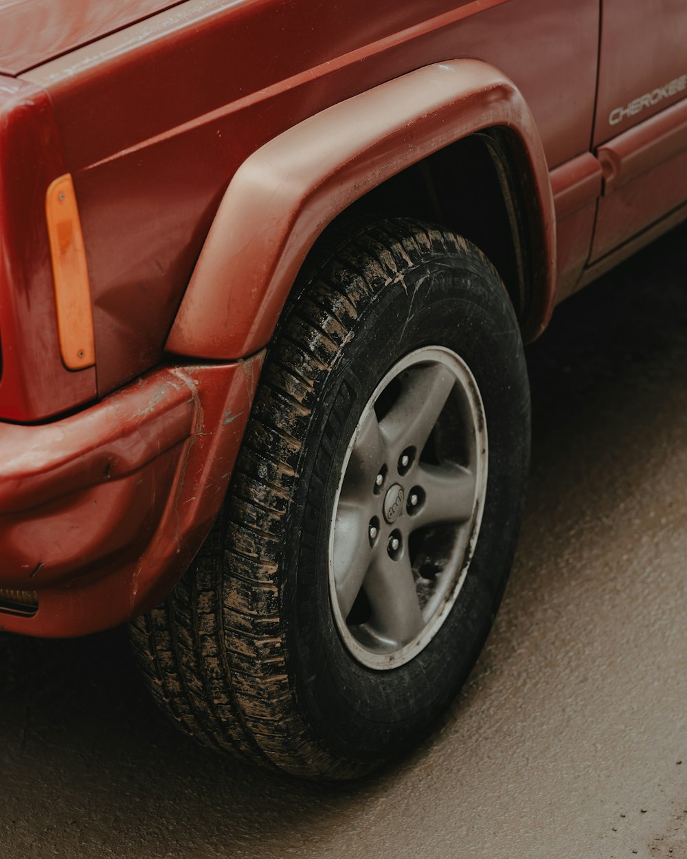 a red truck parked on the side of the road