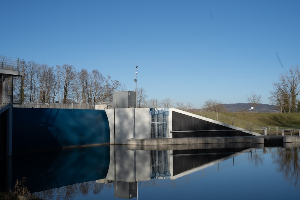 a building sitting next to a body of water