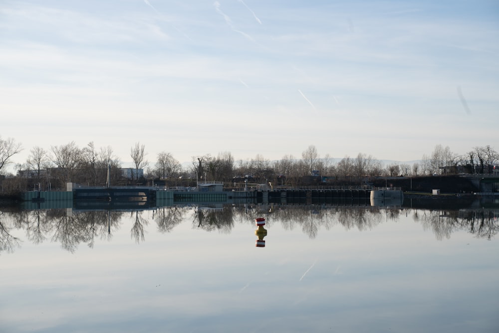 a large body of water with buildings in the background