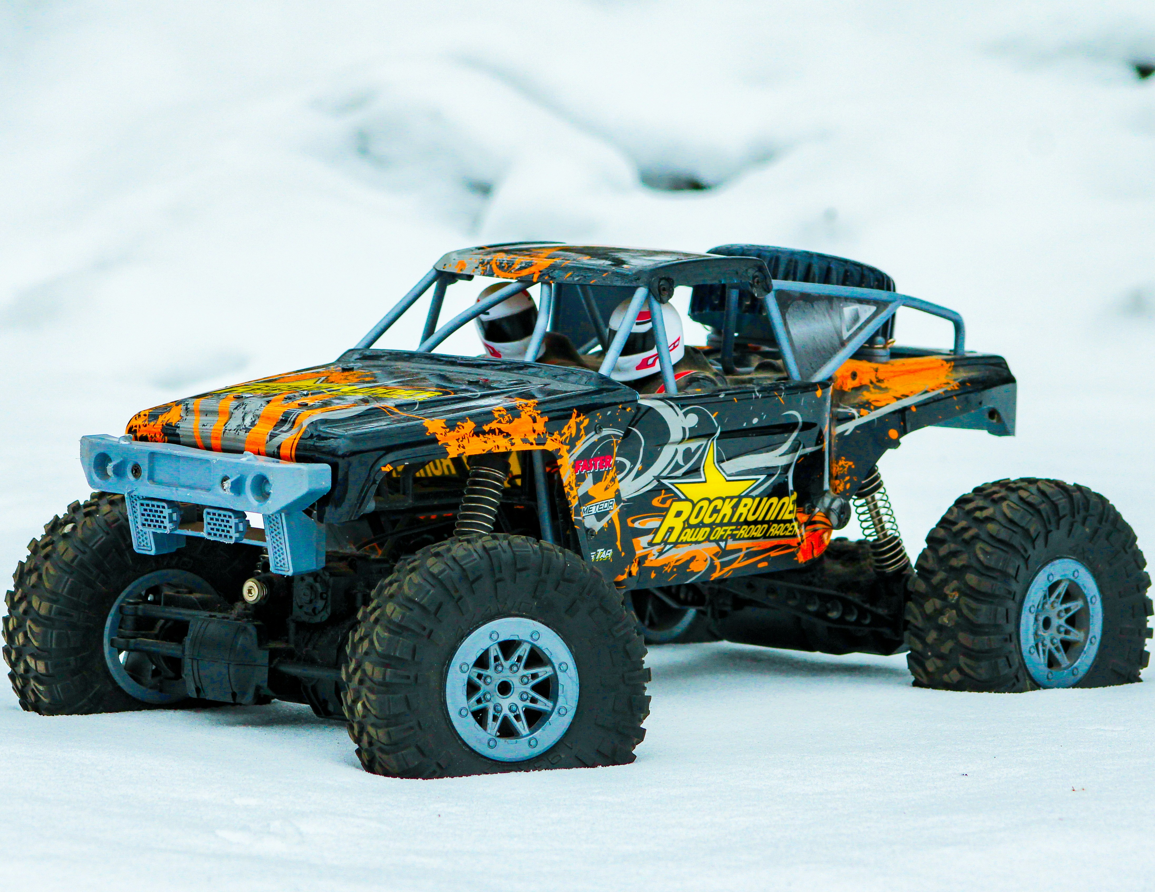 Waterproof rock crawler RC vehicle with articulated suspension climbing wet rocky surface