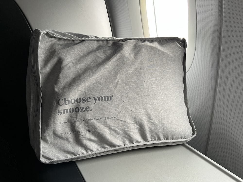a close up of a pillow on an airplane