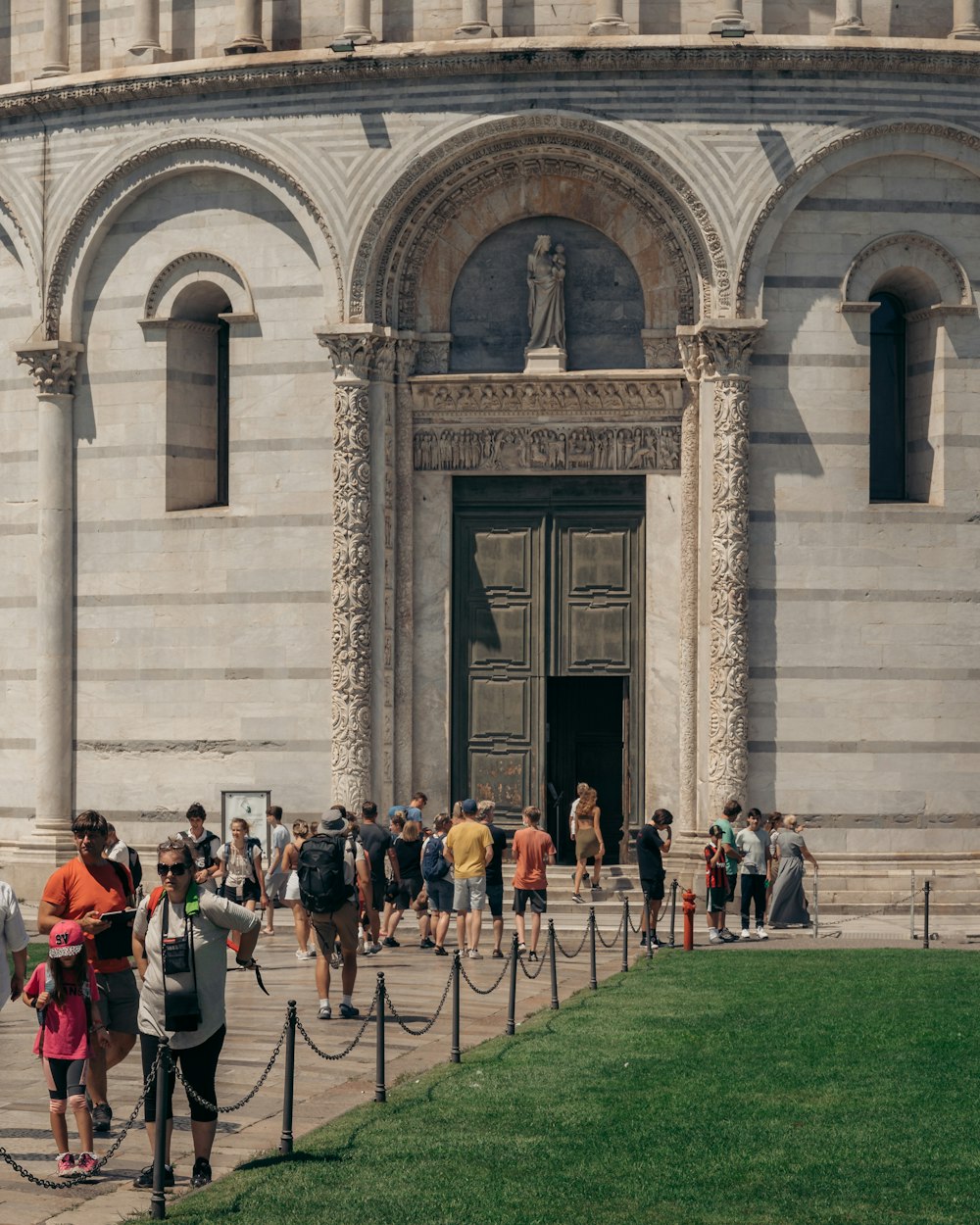 a group of people standing in front of a building