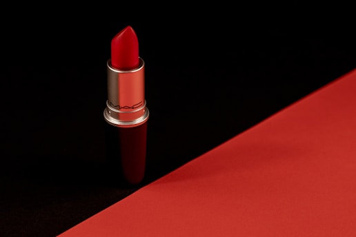 a red lipstick with a black background