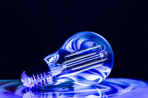 a blue light bulb sitting on top of a table