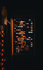a window with a view of a city at night