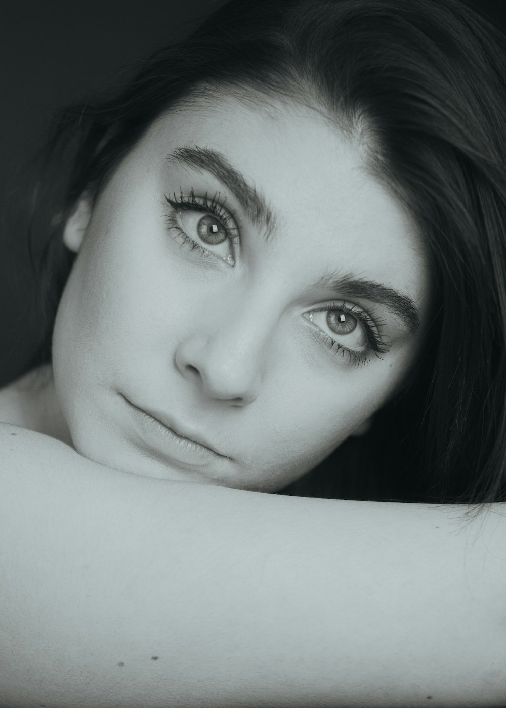 a black and white photo of a woman's face