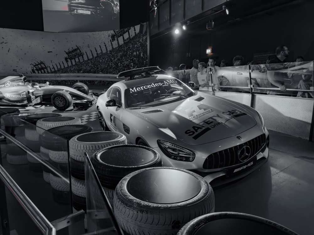a black and white photo of a mercedes race car