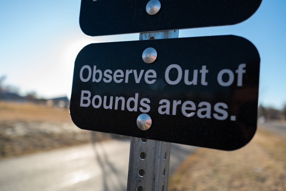 a close up of a street sign with a sky background