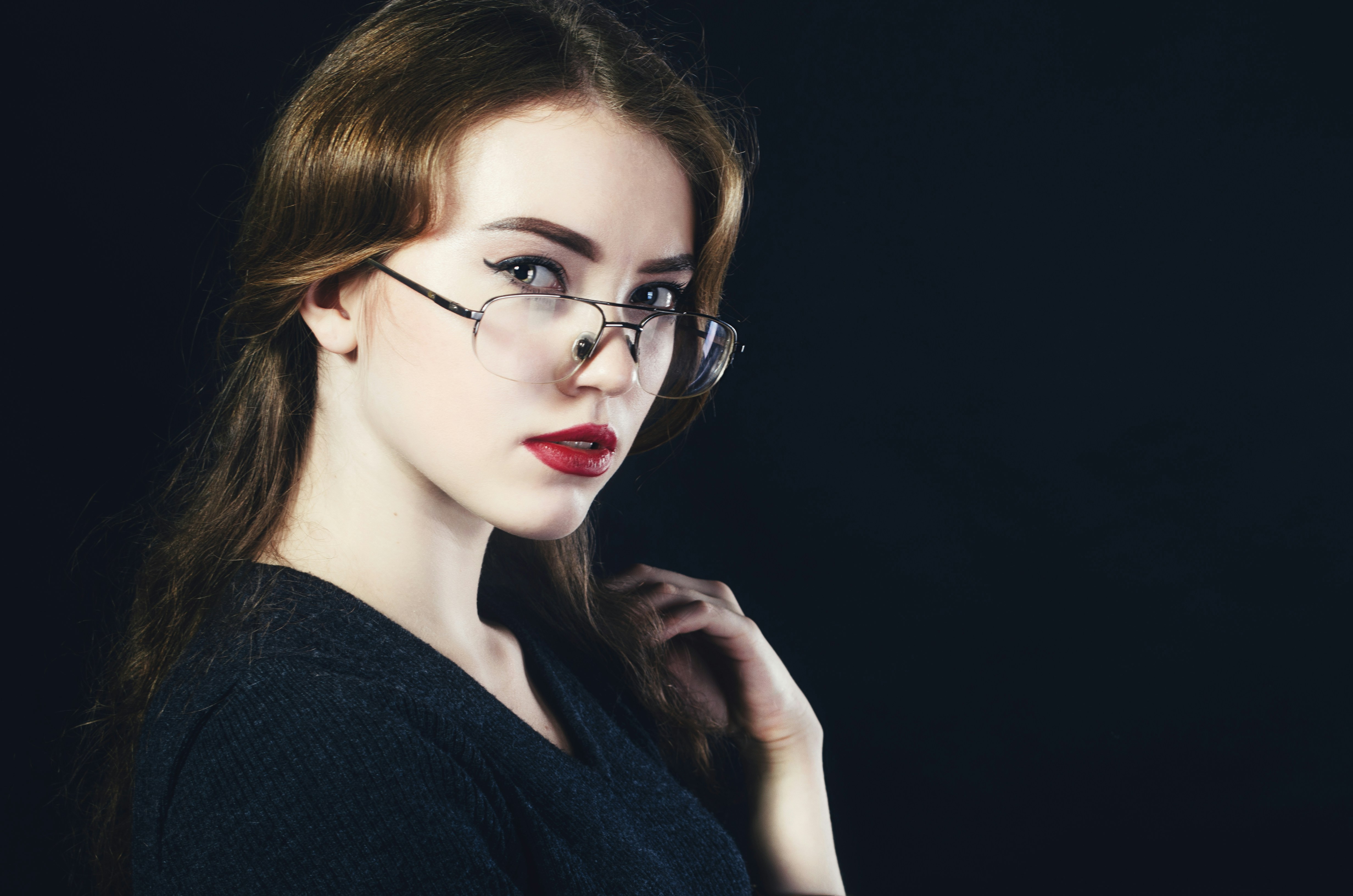woman with glasses posing