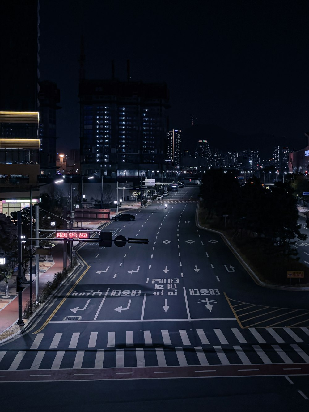 an empty city street at night with no traffic