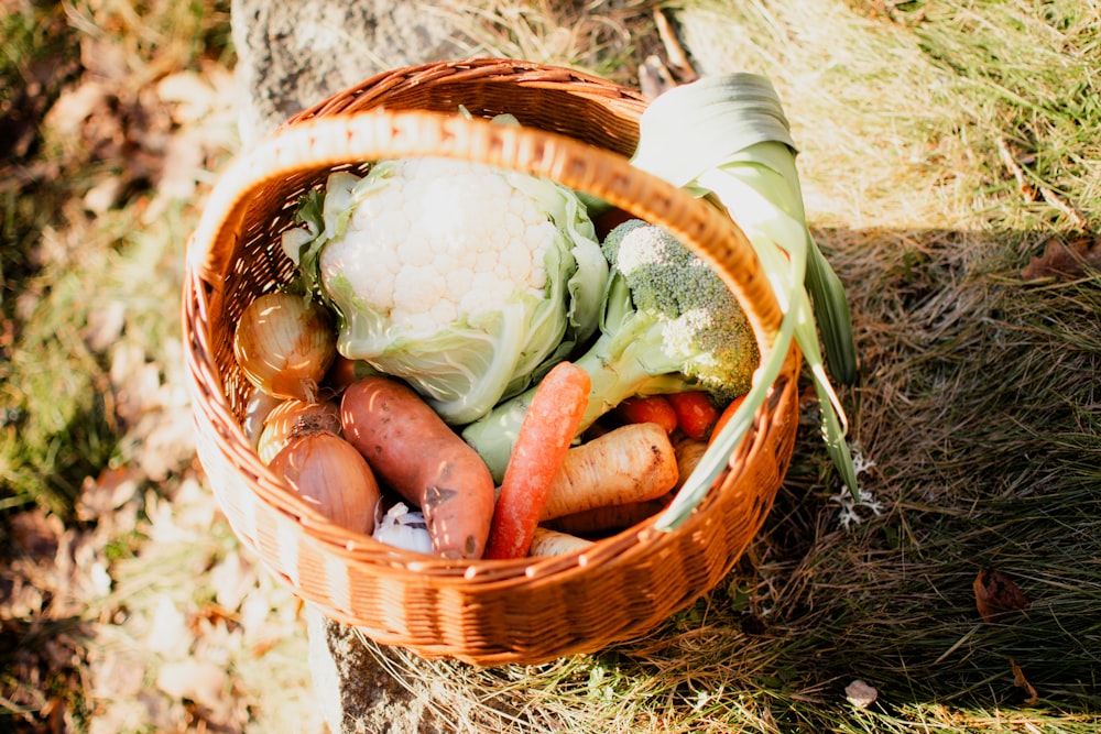 a basket filled with lots of different types of vegetables