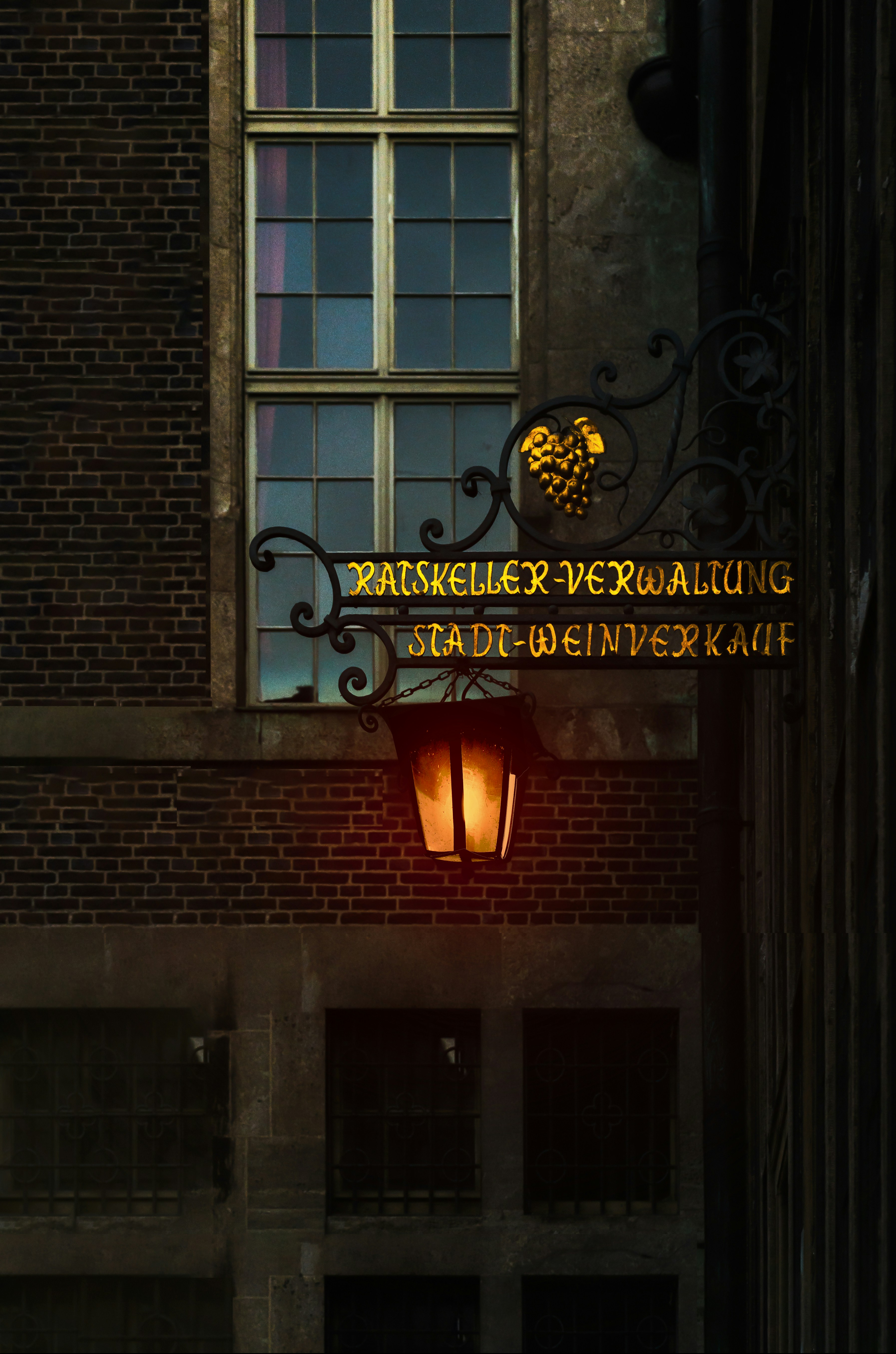 a street light in front of a brick building