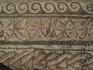 a close up of a mosaic on a wall