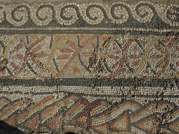 a close up of a mosaic on a wall