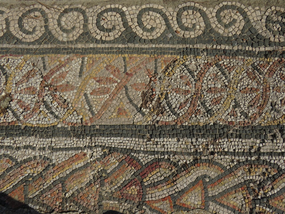 a close up of a mosaic on a wall