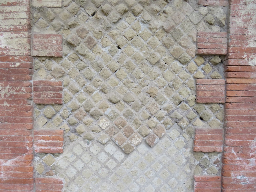 a brick wall with a diamond shaped design on it