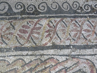 a close up of a mosaic on a wall