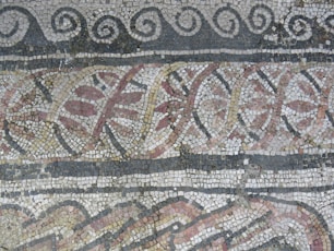a close up of a mosaic on a wall