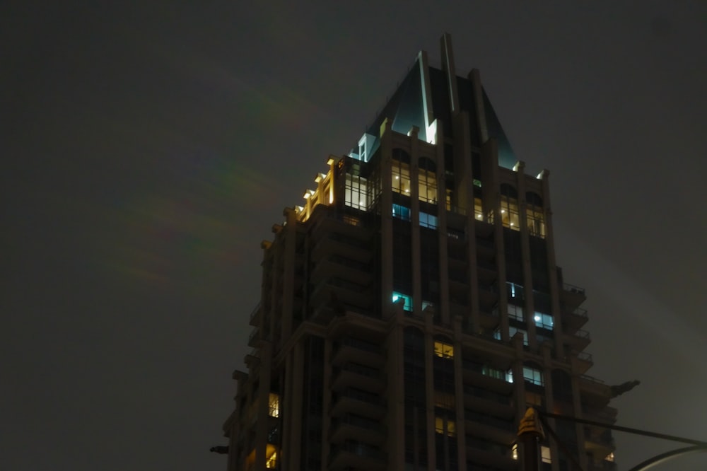 a very tall building lit up at night