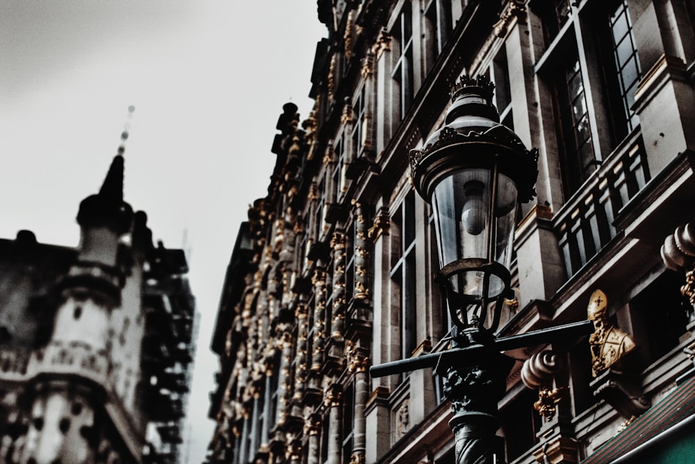 a street light in front of a tall building