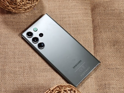 a close up of a cell phone on a cloth