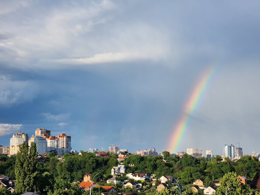 a rainbow in the sky over a city