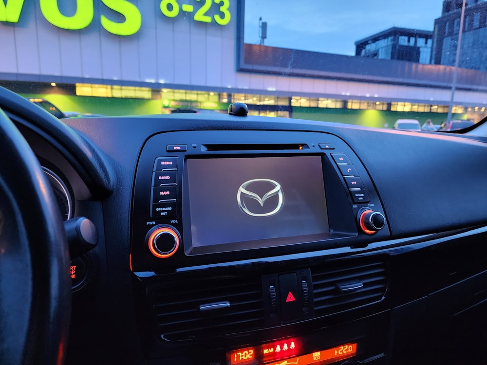 a close up of a car dashboard with a display