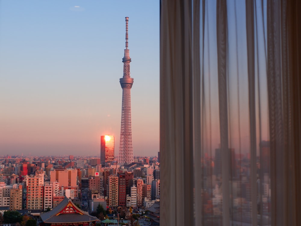 a view of a city at sunset from a window