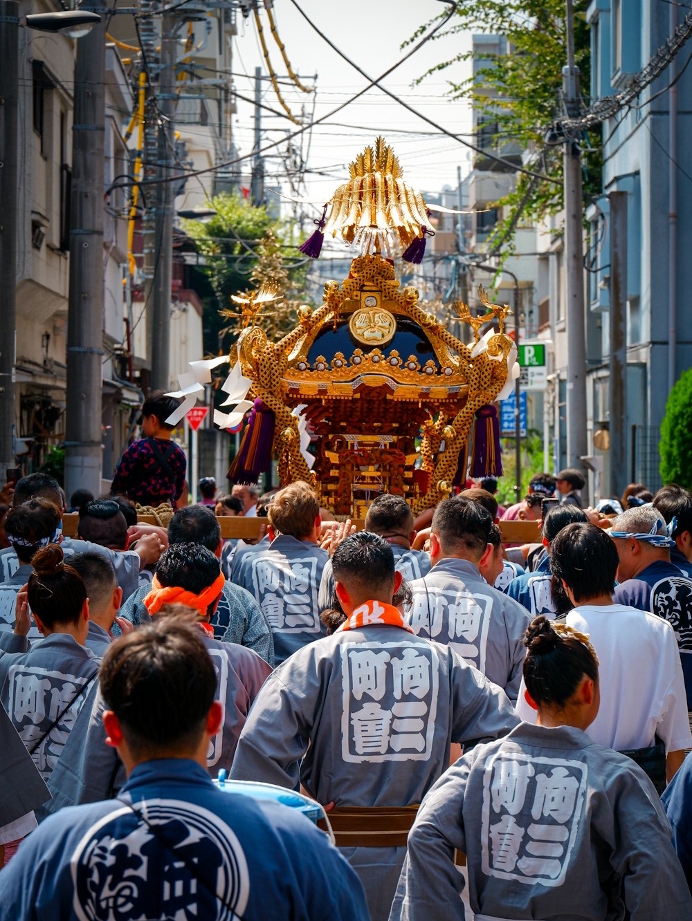 a large group of people walking down a street