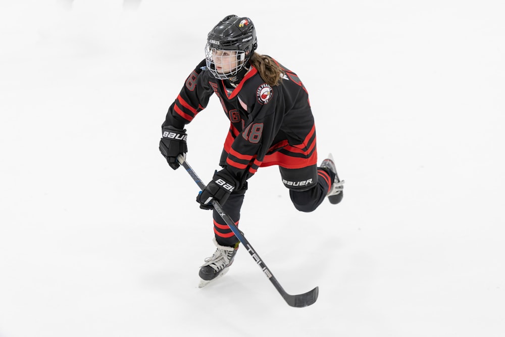 a female hockey player in action on the ice