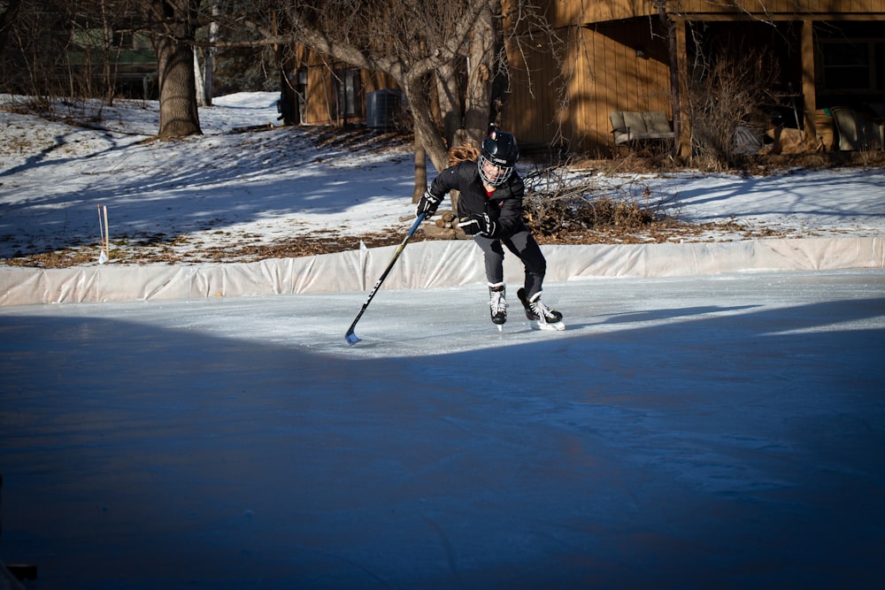 a man riding skis down a snow covered slope