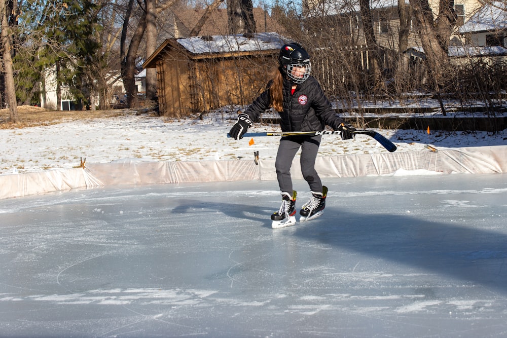 a person on a skateboard on an ice rink